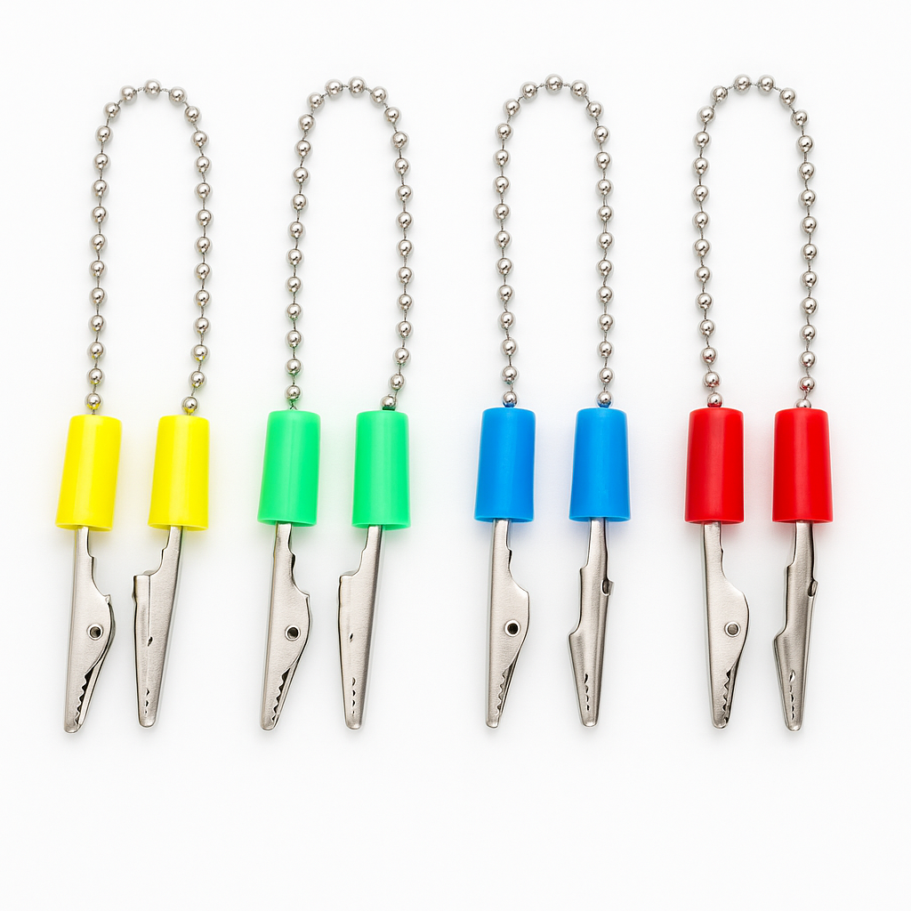 A digital photograph displays four colorful dental bib holders with metal chains and alligator clips, commonly used in dental clinics to secure patient bibs.